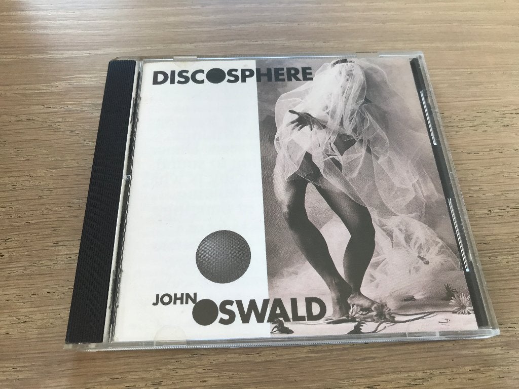 JOHN  OSWALD, Ophalen of Verzenden, Zo goed als nieuw