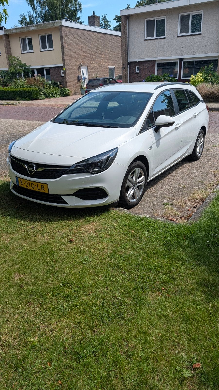 Goed onderhouden Opel Astra Sports Tourer 1.2 Turbo 110pk, Voorwielaandrijving, Stof, Zwart, Wit