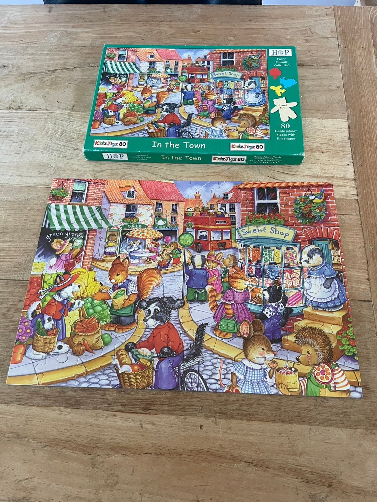 HOP puzzel “ in the town”, Ophalen of Verzenden, 500 t/m 1500 stukjes, Zo goed als nieuw