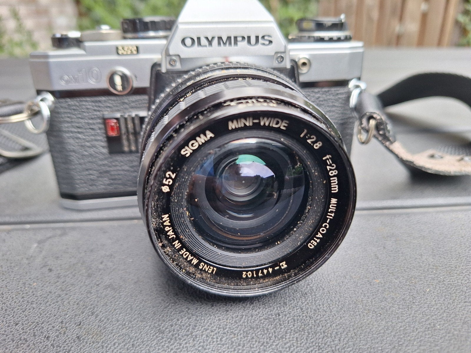 Olympus OM-10 Spiegelreflexcamera met Sigma Mini-Wide lens, Ophalen of Verzenden, Gebruikt, Spiegelreflex, Olympus