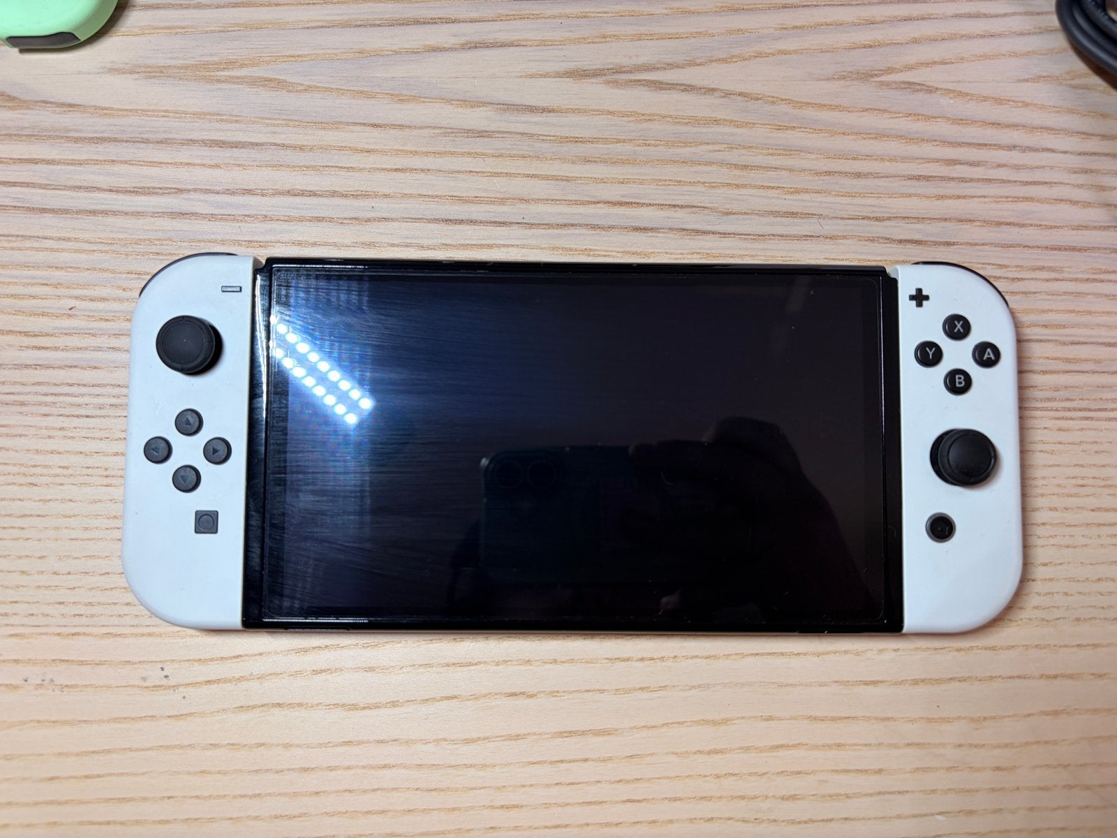 Foto 3 van Nintendo Switch OLED met extra controllers en games