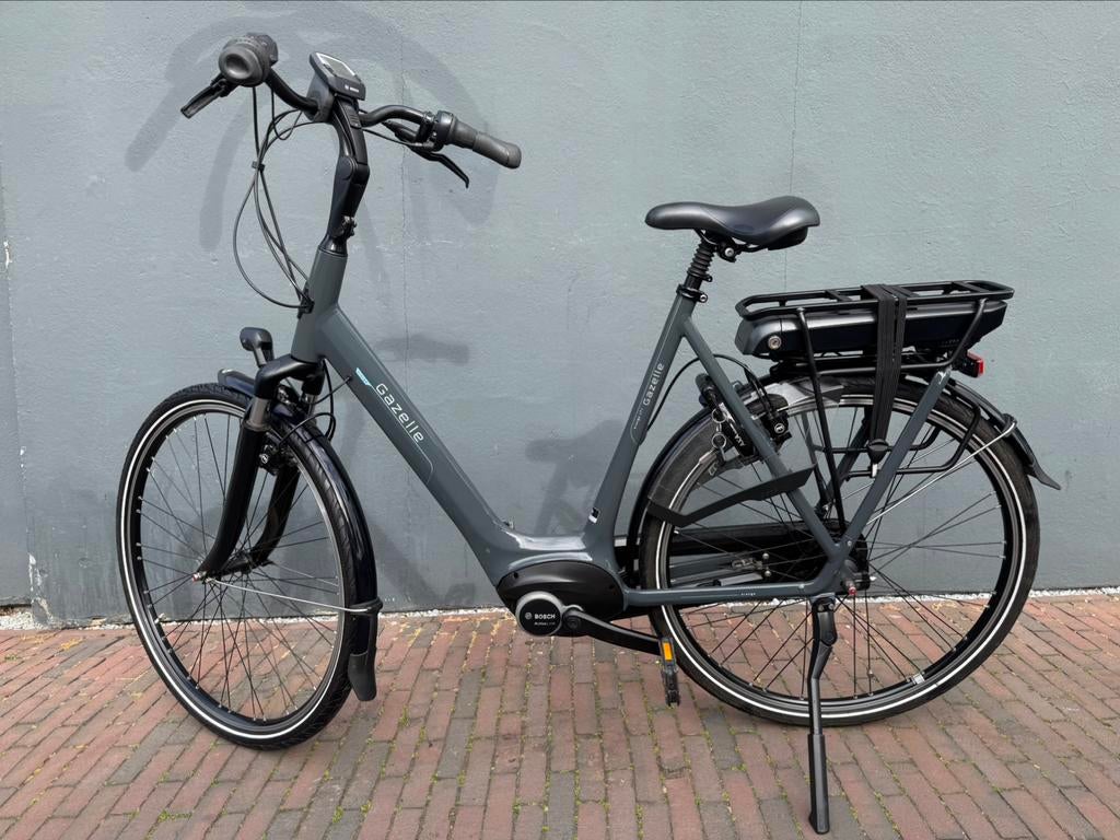 Gazelle Orange C7+ D61cm 400W 2932KM Garantie, Ophalen, Zo goed als nieuw, 59 cm of meer, 50 km per accu of meer