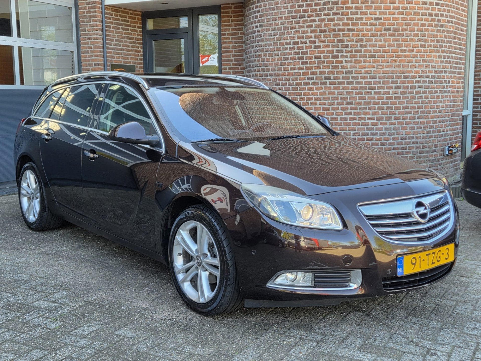 Opel Insignia Sports Tourer 1.4 Turbo EcoFLEX Cosmo | PDC |, Auto's, Opel, Euro 5, 4 cilinders, Bruin, Leder en Stof