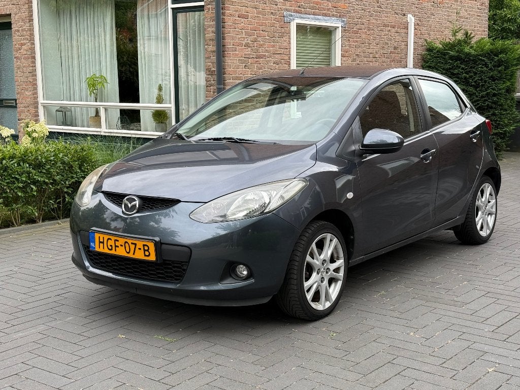 Mazda 2 1.3 55KW 5DRS 2010 Grijs, Auto's, Voorwielaandrijving, Zwart, 4 cilinders, 1349 cc