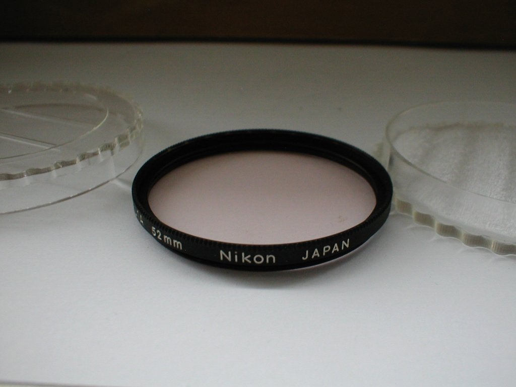 Nikon L1A 52mm filter, Gebruikt, UV-filter, Inclusief opbergcase, Ophalen of Verzenden