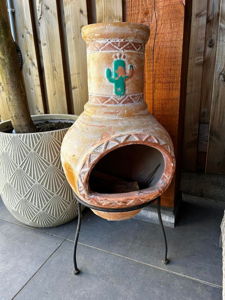 Tuinhaard met zakje stookhout, Ophalen