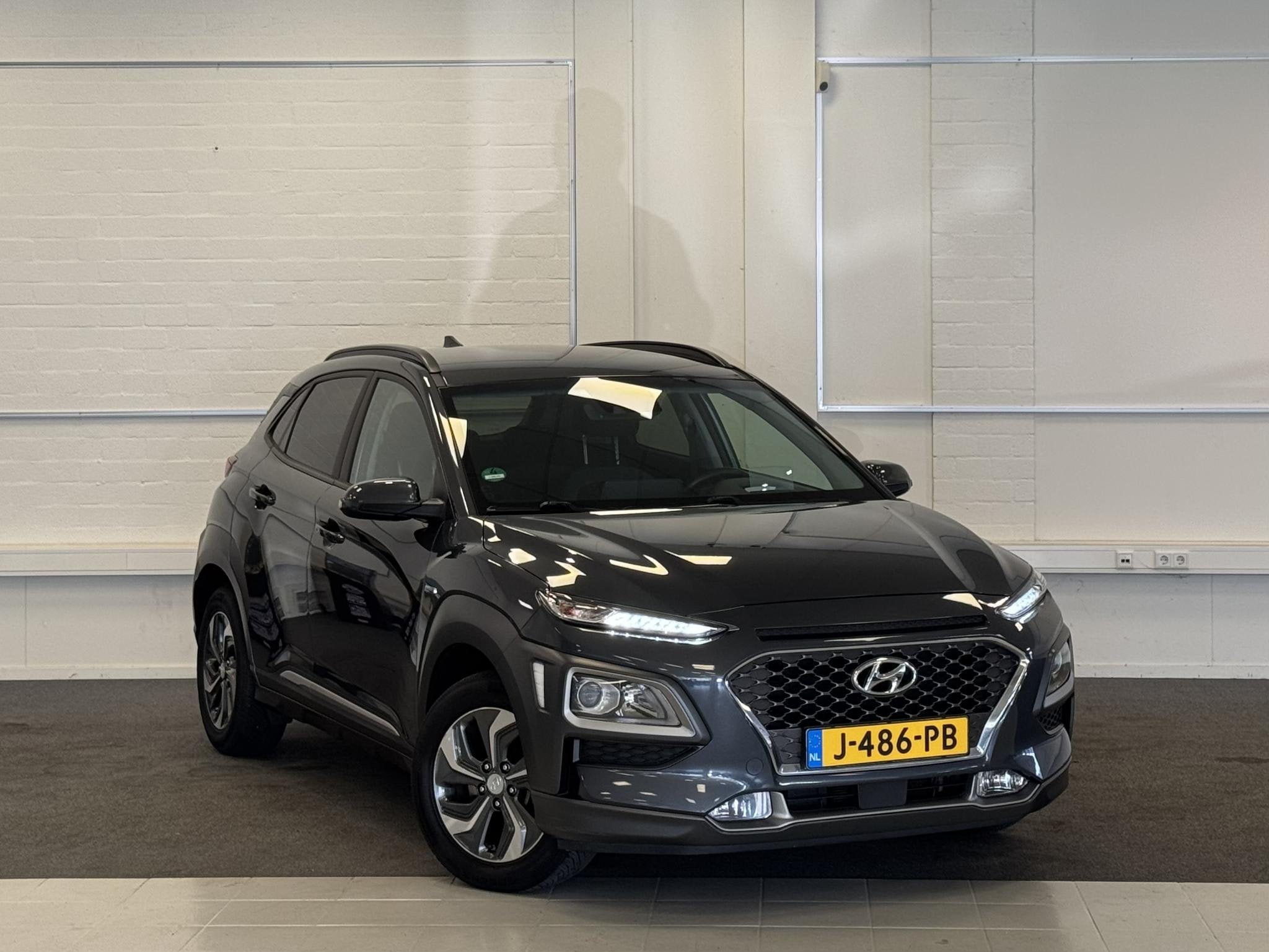 Hyundai Kona 1.6 GDI HEV Fashion HUD Clima Cruise Allseason, Stof, Gebruikt, Euro 6, 2 kWh