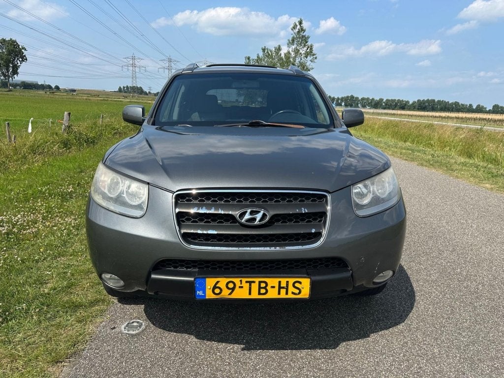 Hyundai Santa Fe 2.7i V6 Dynamic 7p. (bj 2006), Auto's, Automatische klimaatregeling, Santa Fe, 2000 kg, Bedrijf