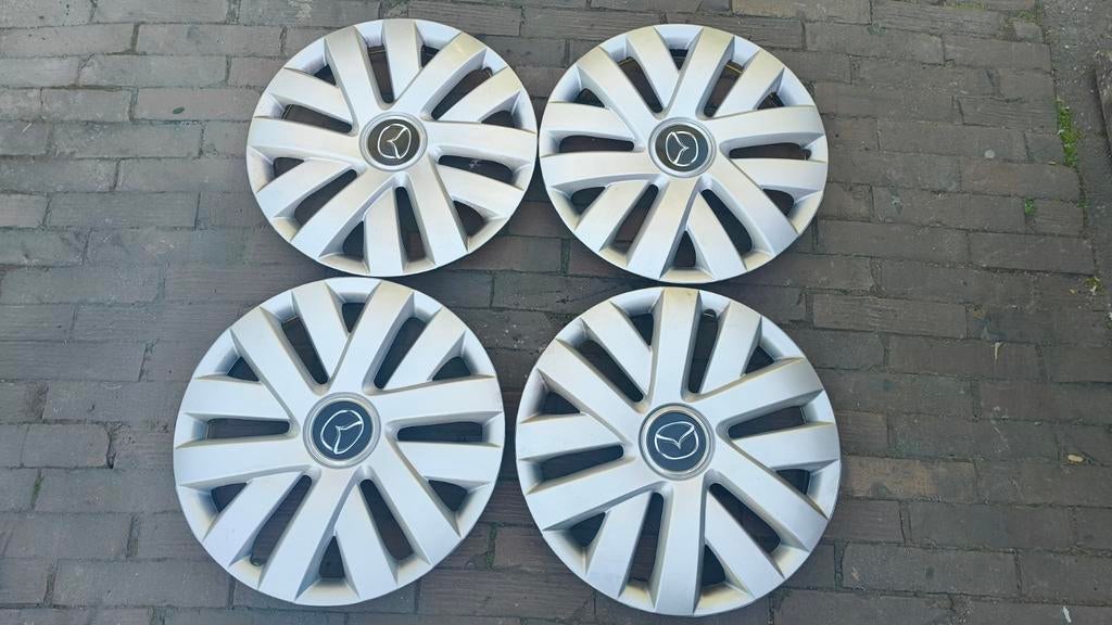 Set van 4 Mazda wieldoppen, Ophalen, Zo goed als nieuw