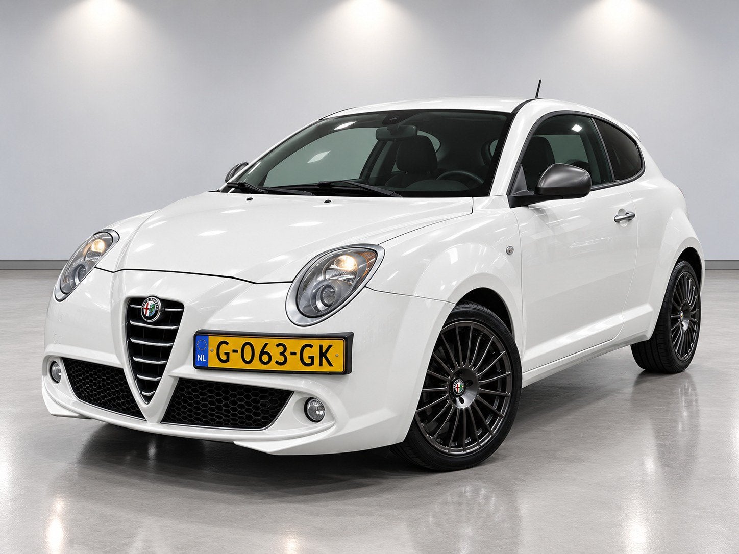 Alfa Romeo MiTo 1.4 8V S&S 78pk 2015 Wit, Auto's, Voorwielaandrijving, Stof, Euro 6, 4 cilinders