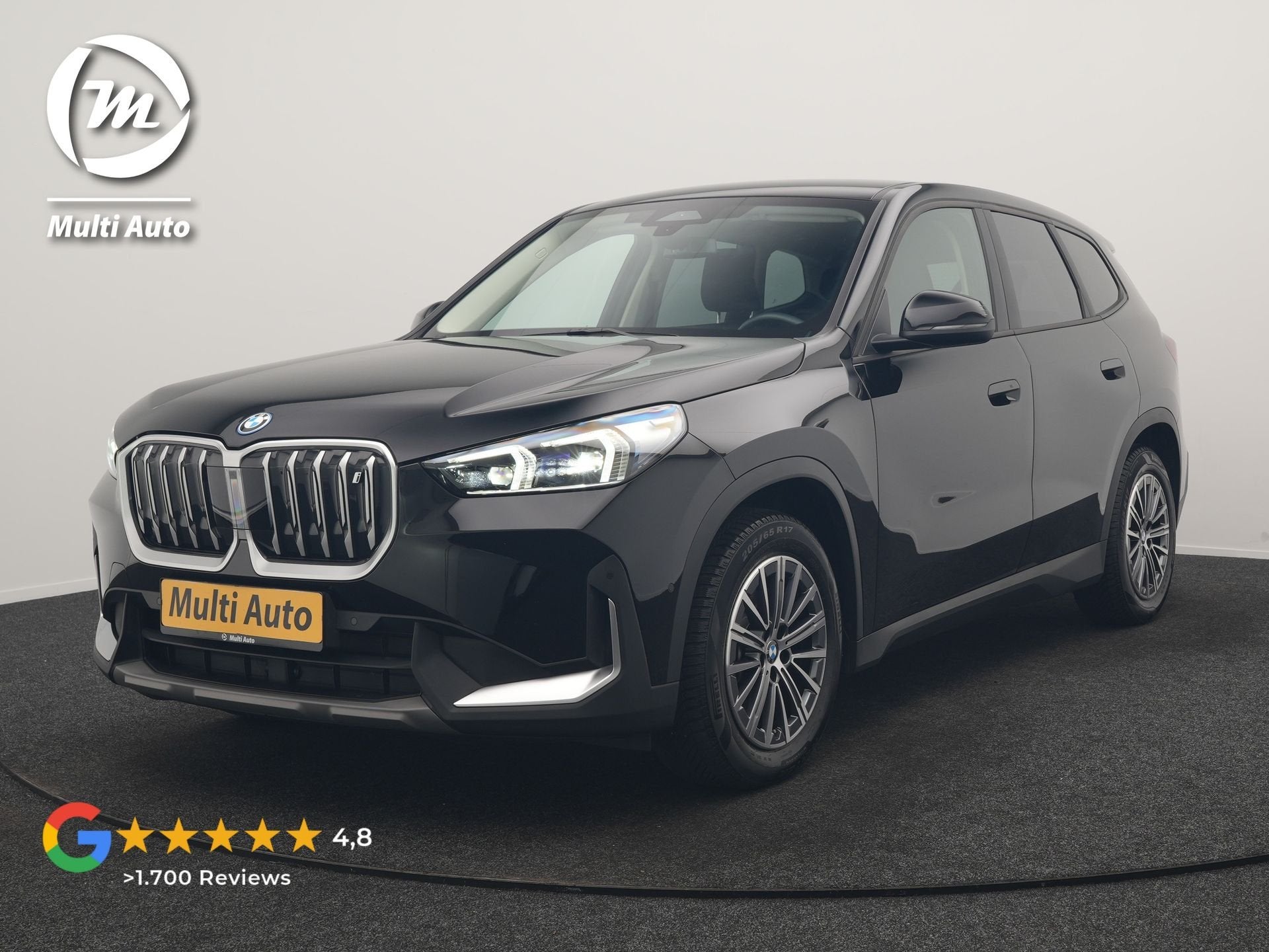 BMW iX1 xDrive30 67 kWh 313pk Dealer O.H. | Trekhaak Af Fabr, Auto's, Automaat, Dealer onderhouden, Stof, Gebruikt