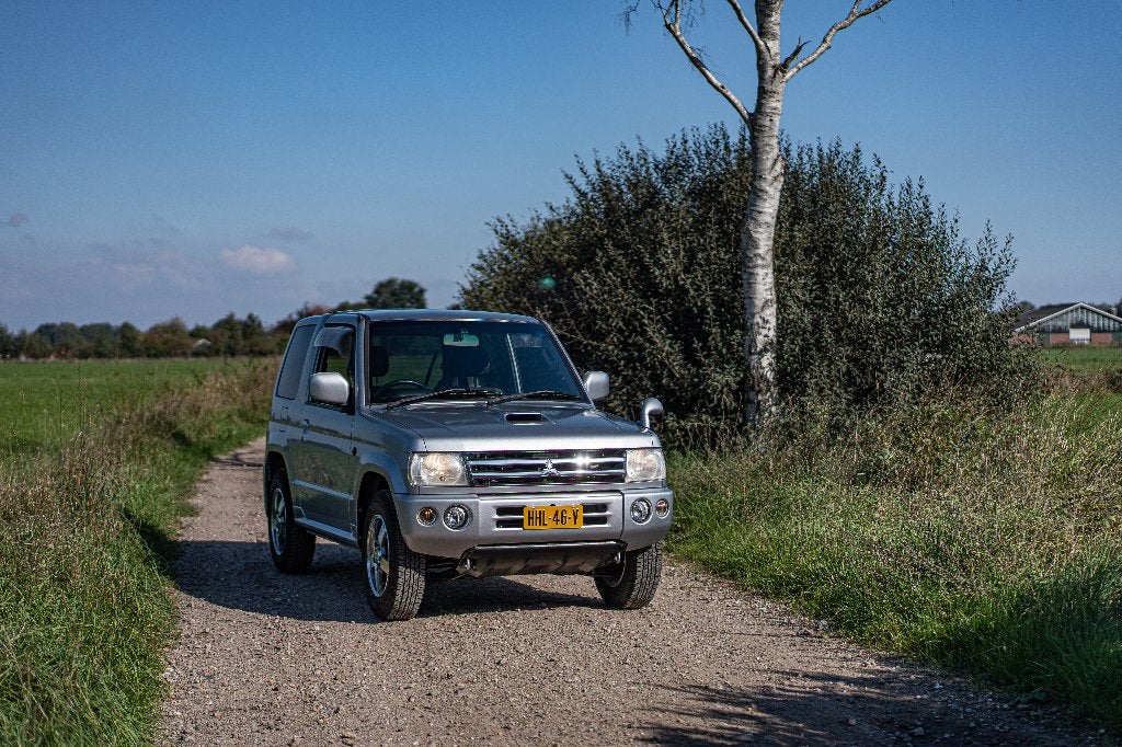 Unieke Mitsubishi Pajero Mini 0.6 Turbo Automaat 4x4 (2006), Auto's, Automaat, Stof, 64 pk, Zwart