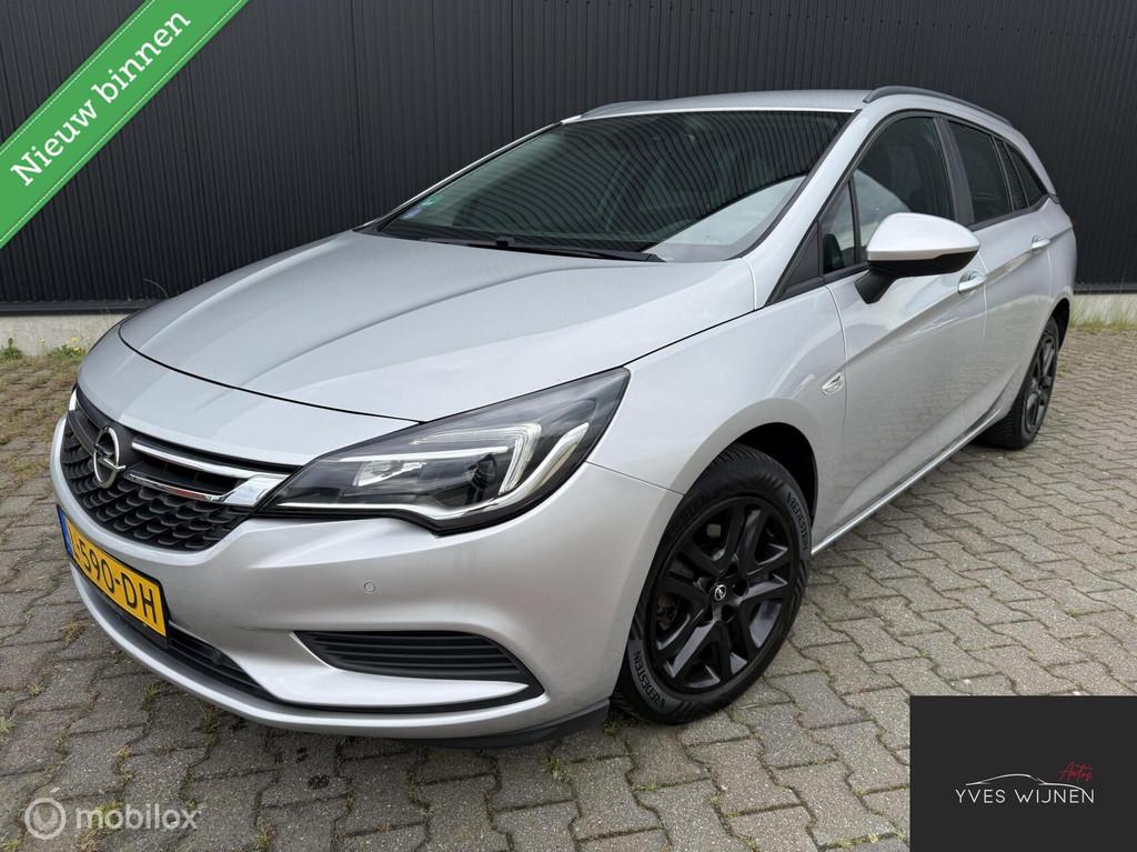 Opel Astra Sports Tourer 1.4TURBO 150pk PDC TREKHAAK NAVI, Auto's, Voorwielaandrijving, Bluetooth, Stof, Gebruikt