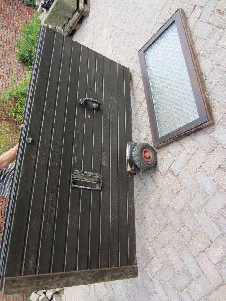Buitendeur 212x105,5 plus bovenlicht 112x59 met dubbel glas
