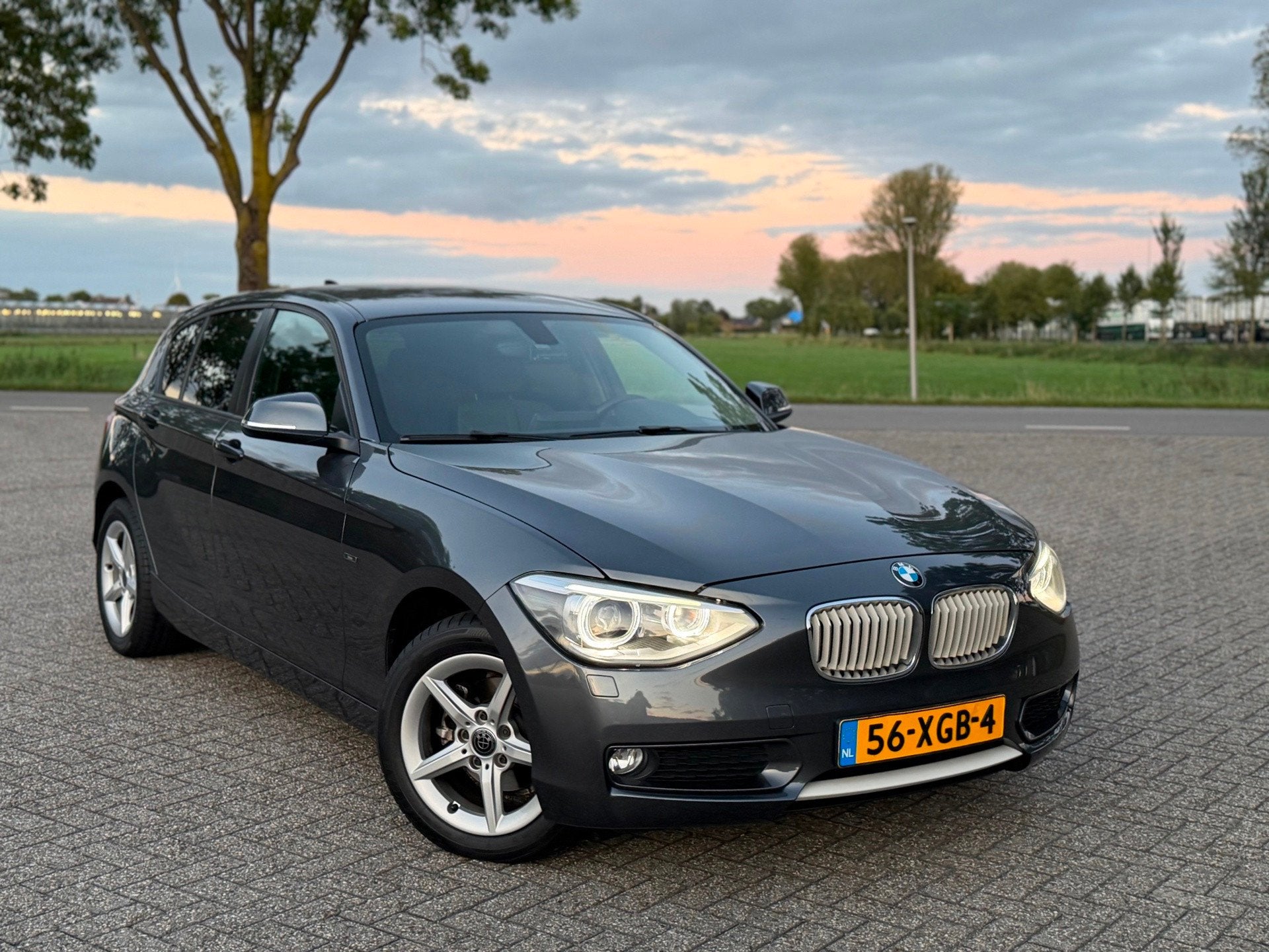 BMW 1-serie 116i Urban-Line 5D (bj 2012) NAVI|BI-XENON|LMV|A, Auto's, 1-Serie, Euro 5, Gebruikt, Zwart