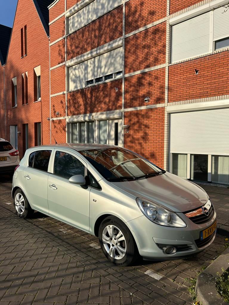 Opel Corsa 1.2 16V 5D 2010 groen/blauw/grijs, Auto's, Voorwielaandrijving, 4 cilinders, 1229 cc, 49 €/maand