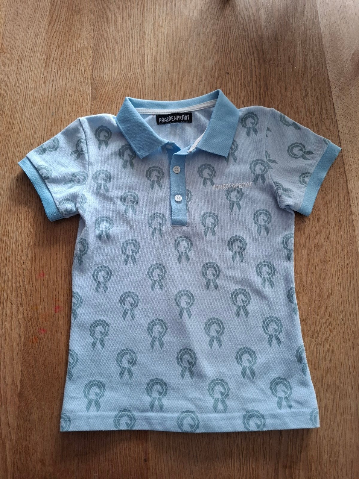 Paardenpraattv blauwe polo maat 122/128, Ophalen of Verzenden, Zo goed als nieuw, Shirt of Longsleeve