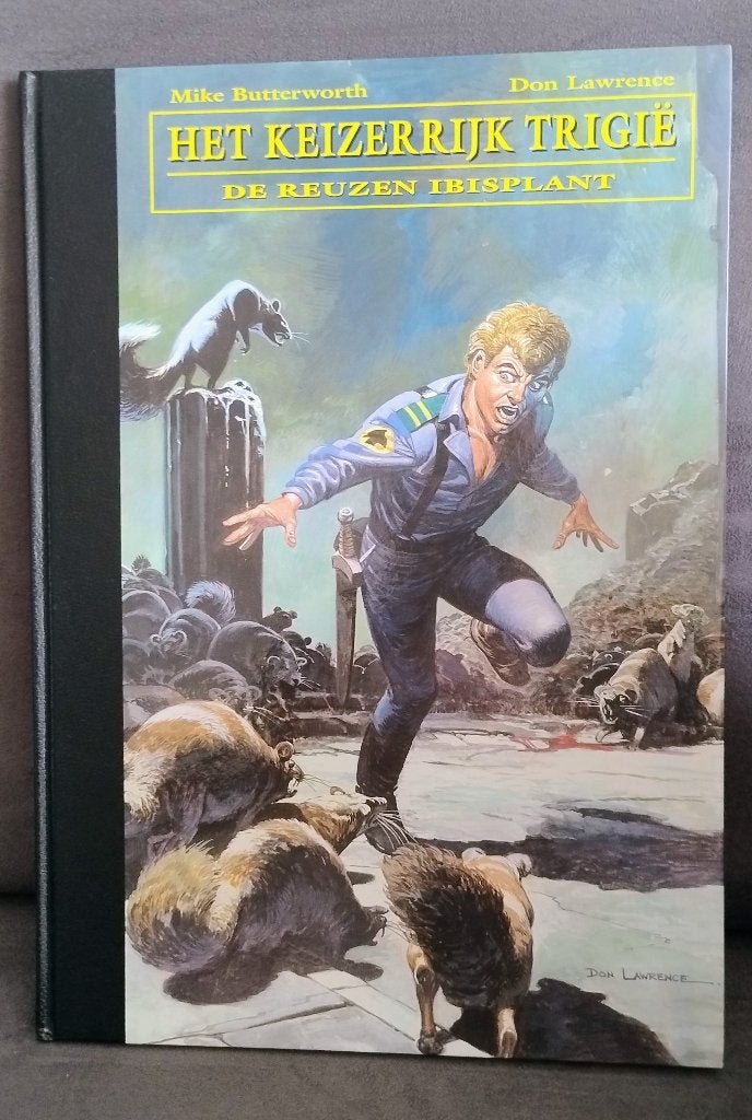 Trigië - The Collection deel 7 (exempl. 1), Boeken, Ophalen of Verzenden, Zo goed als nieuw, Don Lawrence, Mike Butterworth, Eén stripboek