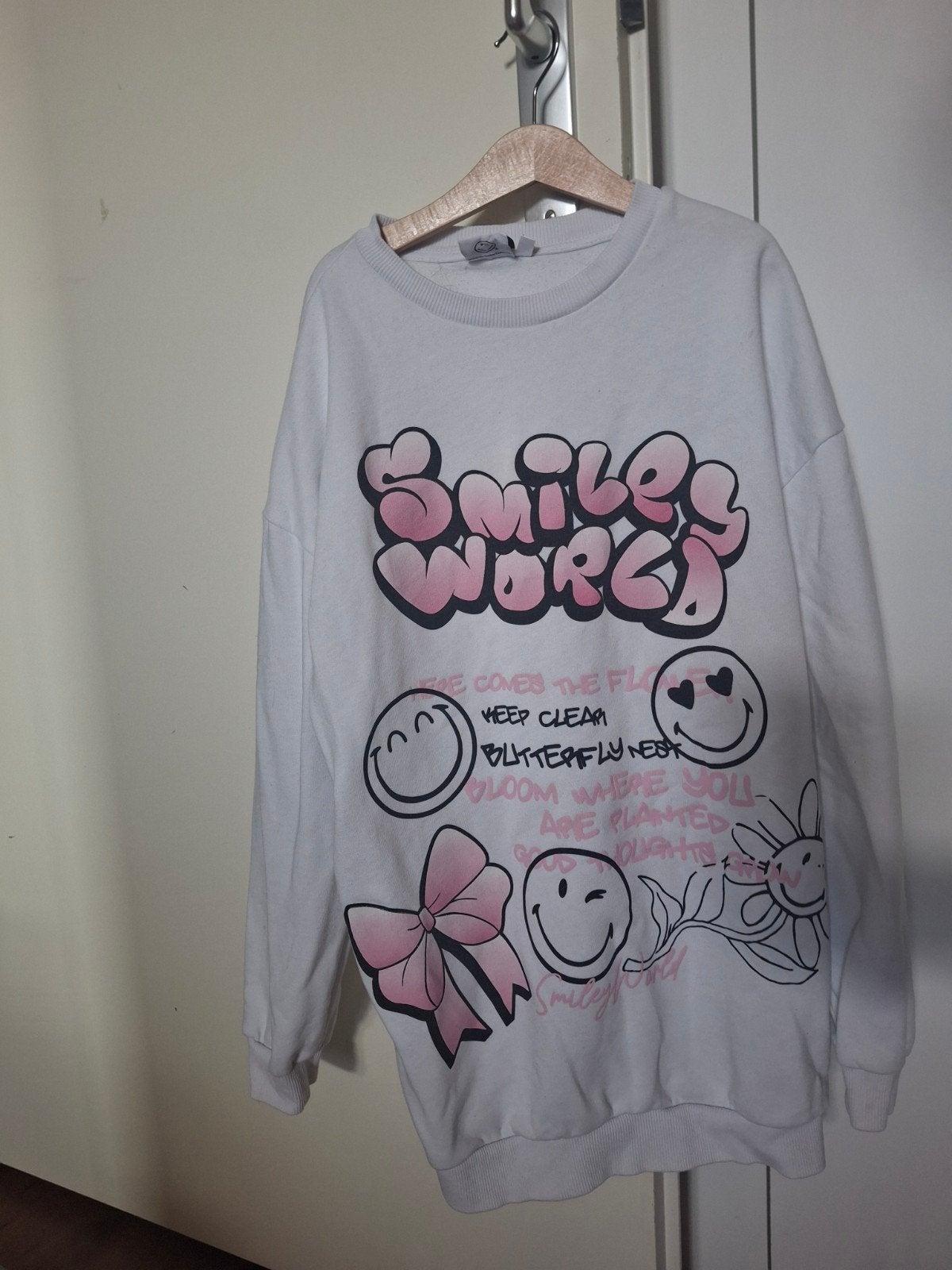 Witte trui met 'Smiley World' print en roze strik, Wit, Ophalen of Verzenden, Onbekend, Maat 34 (XS) of kleiner