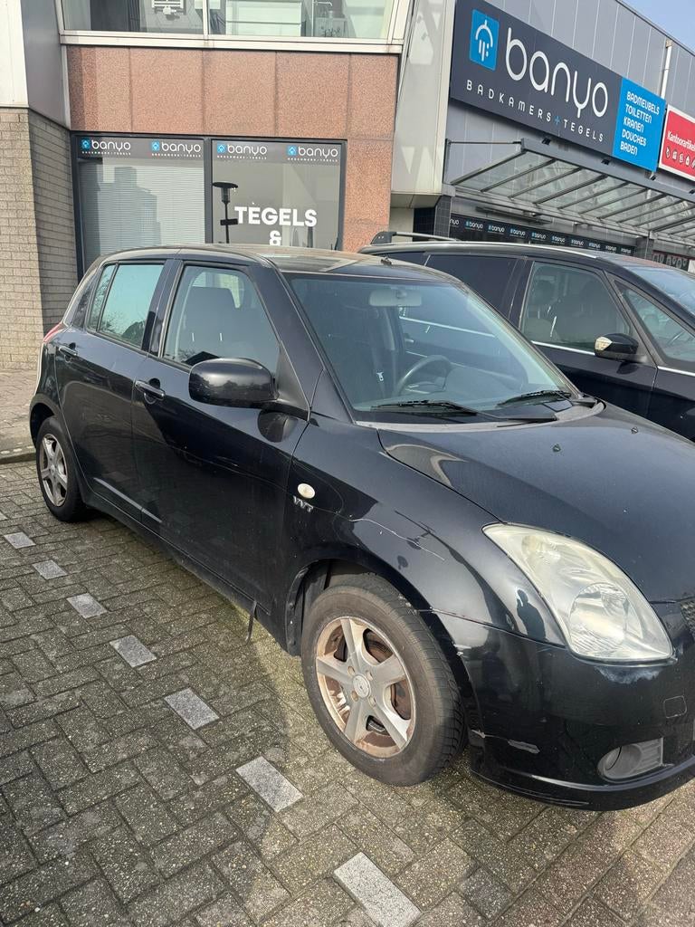 Suzuki Swift 1.5 5D 2005 Zwart, Auto's, Suzuki, Voorwielaandrijving, 15 km/l, 40 €/maand, 4 cilinders