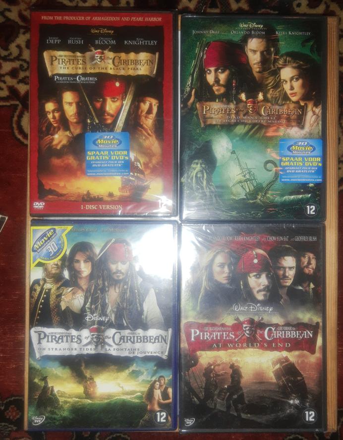 4x PIRATES of the Caribbean 1-2-3-4 / I-II-III-IV / Piraten, Vanaf 12 jaar, Ophalen of Verzenden, Zo goed als nieuw