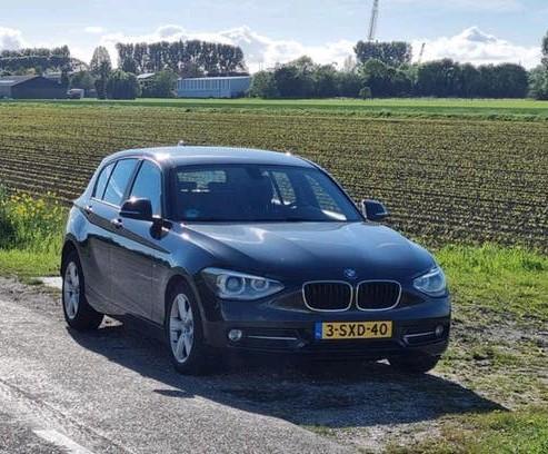BMW 1-Serie 116I 100KW 5DR 2013 Zwart, Auto's, BMW, 1-Serie, Zwart, 4 cilinders, Zwart