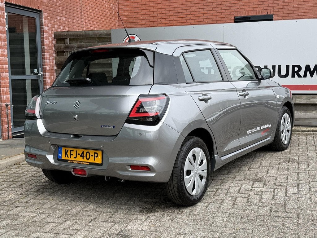 Suzuki Swift 1.2 Comfort Smart Hybrid DEMO DEAL, Achteruitri, Auto's, Suzuki, 12 maanden, Stof, Euro 6, Origineel Nederlands