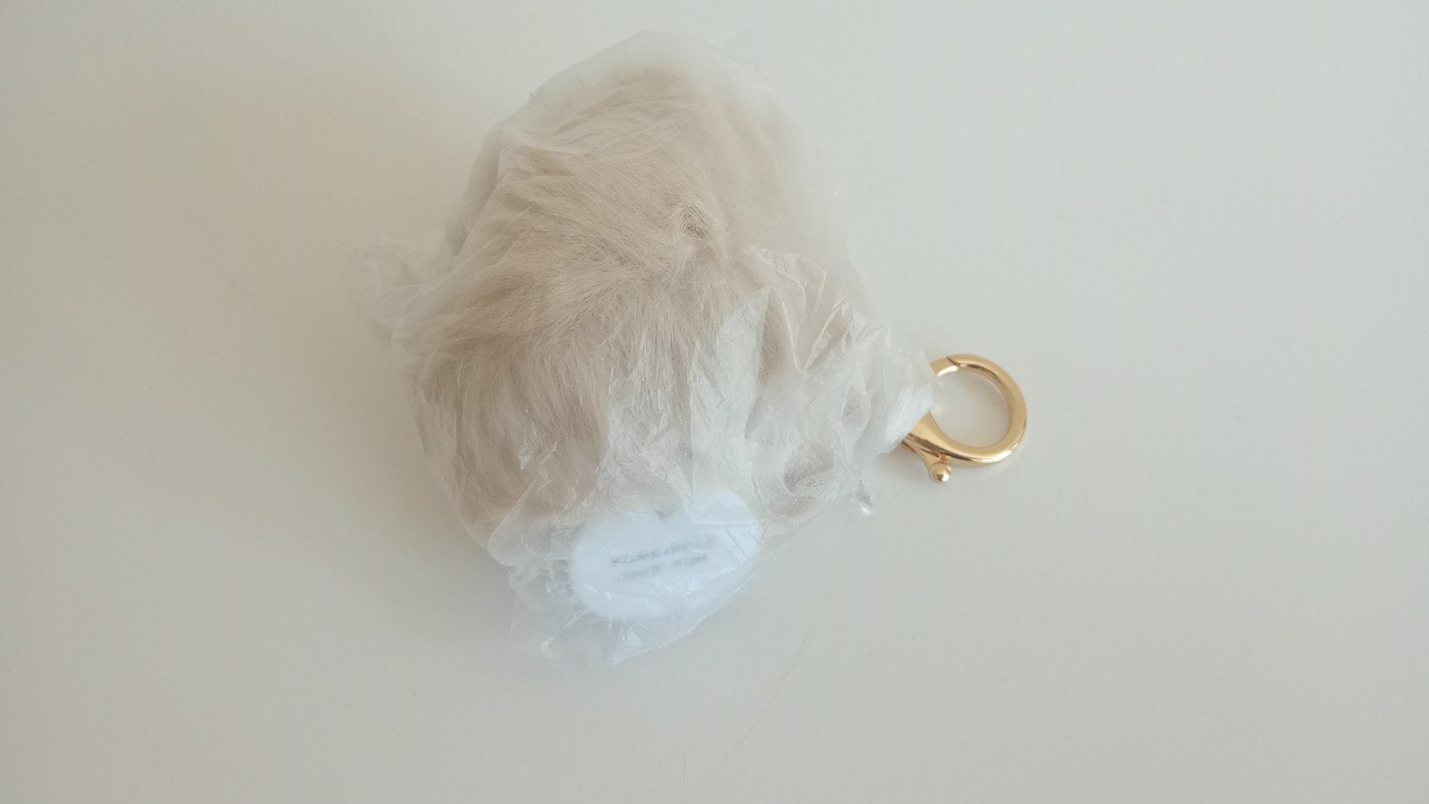 Gouden sleutelhanger met pluizige pompon, Ophalen of Verzenden, Nieuw, Overige typen