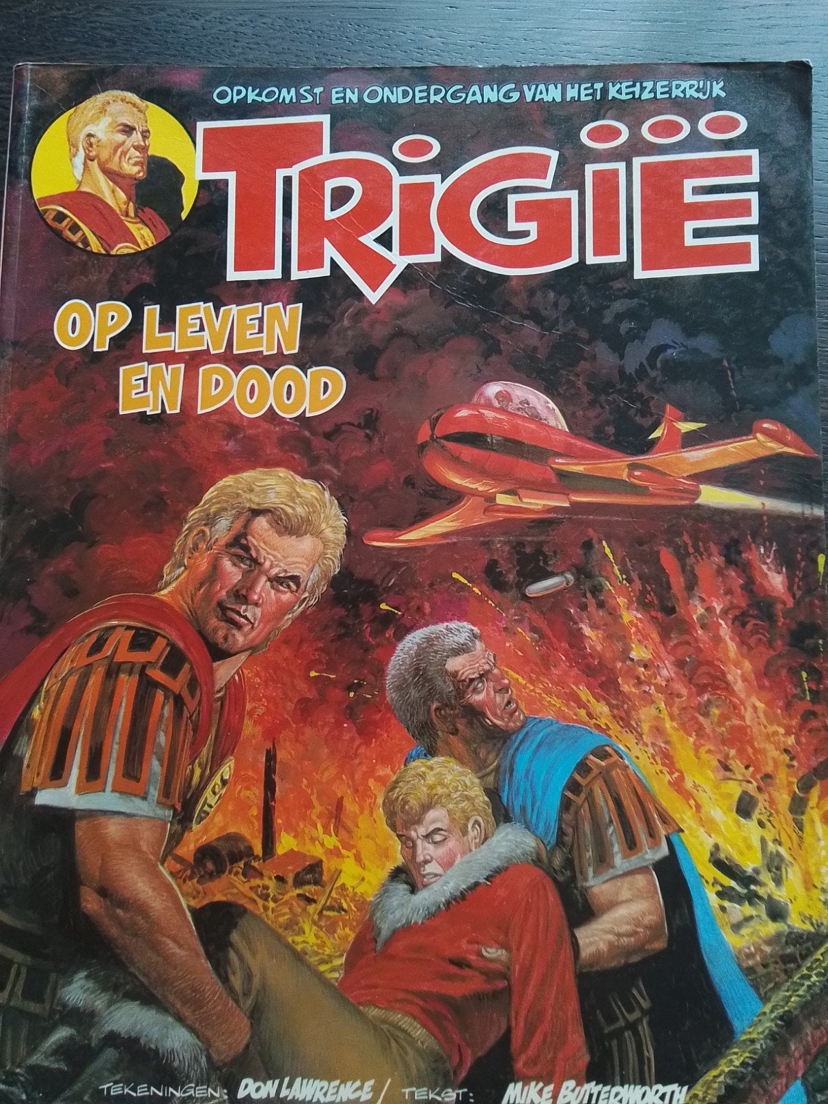 Trigië. Op leven en dood, Gelezen, Ophalen of Verzenden, Don Lawrence, Mike Butterworth, Eén stripboek