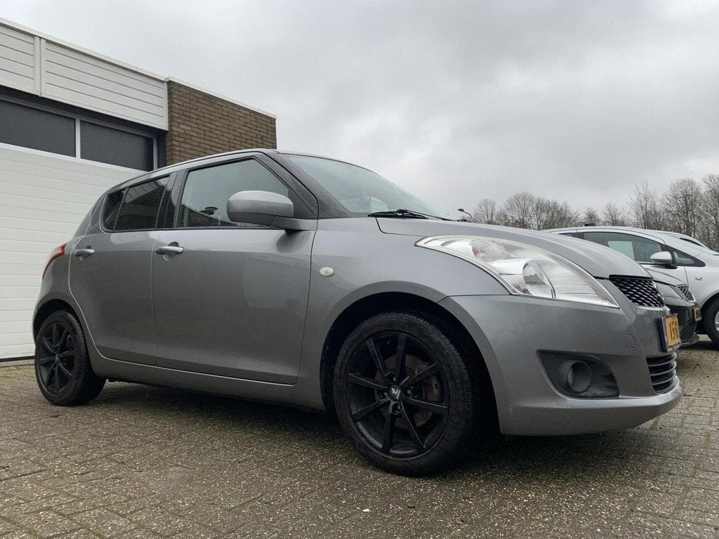 Suzuki Swift 1.2 Exclusive 5DR NWE APK Airco Cruise Control, Voorwielaandrijving, Gebruikt, 4 cilinders, 400 kg