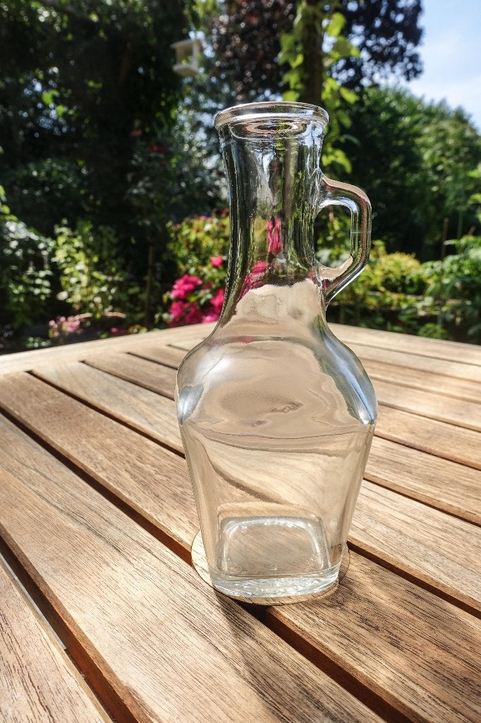 glazen vaasje met oortje, Huis en Inrichting, Woonaccessoires | Vazen, Ophalen, Zo goed als nieuw, Transparant, Glas
