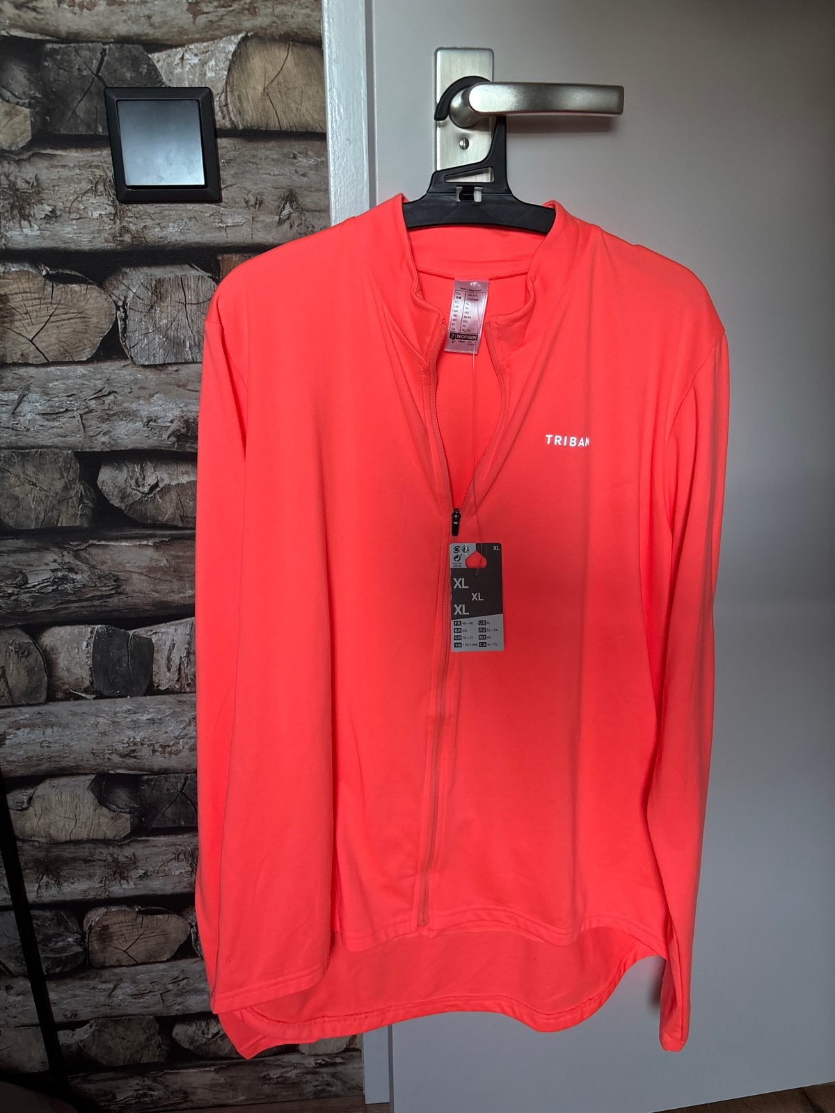 Triban hardloopjack XL - Nieuw met kaartjes, Maat 46/48 (XL) of groter, Nieuw, Oranje, Ophalen of Verzenden