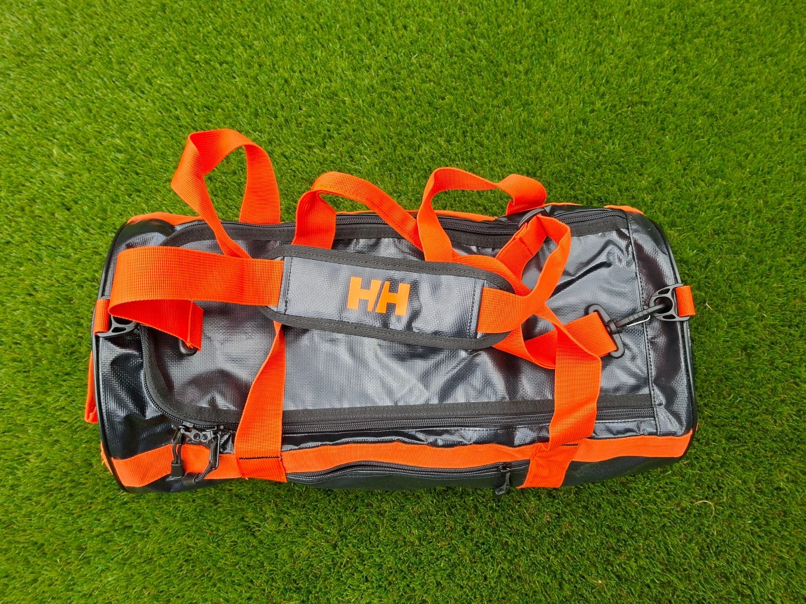 Helly Hansen Sporttas/Reistas Zwart/Oranje, Sieraden, Tassen en Uiterlijk, Tassen | Reistassen en Weekendtassen, 40 tot 60 cm