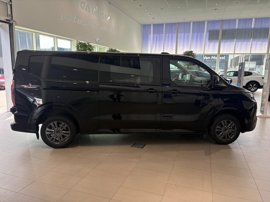 Ford E-Transit Cust. 320 L2H1 Limited 65 kWh CAMERA | APPLE, Automaat, Gebruikt, Met garantie (alle), 2192 kg