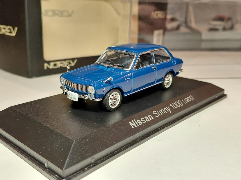Nissan Datsun 1000 mk1 (B10) 1966-1970 blauw 1/43 Norev, Hobby en Vrije tijd, Modelauto's | 1:43, Ophalen of Verzenden, Zo goed als nieuw