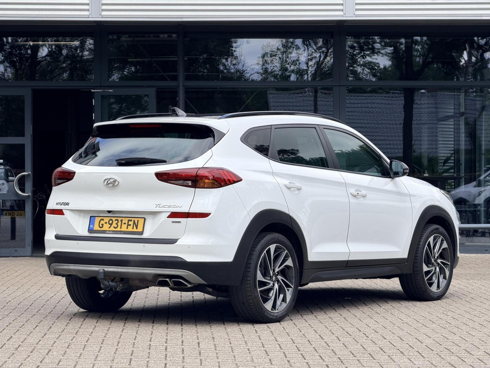 Hyundai Tucson 1.6 T-GDi Premium 4WD | Pano | Stoel-Stuurver, Auto's, Gebruikt, 4 cilinders, Lichtsensor, Wit
