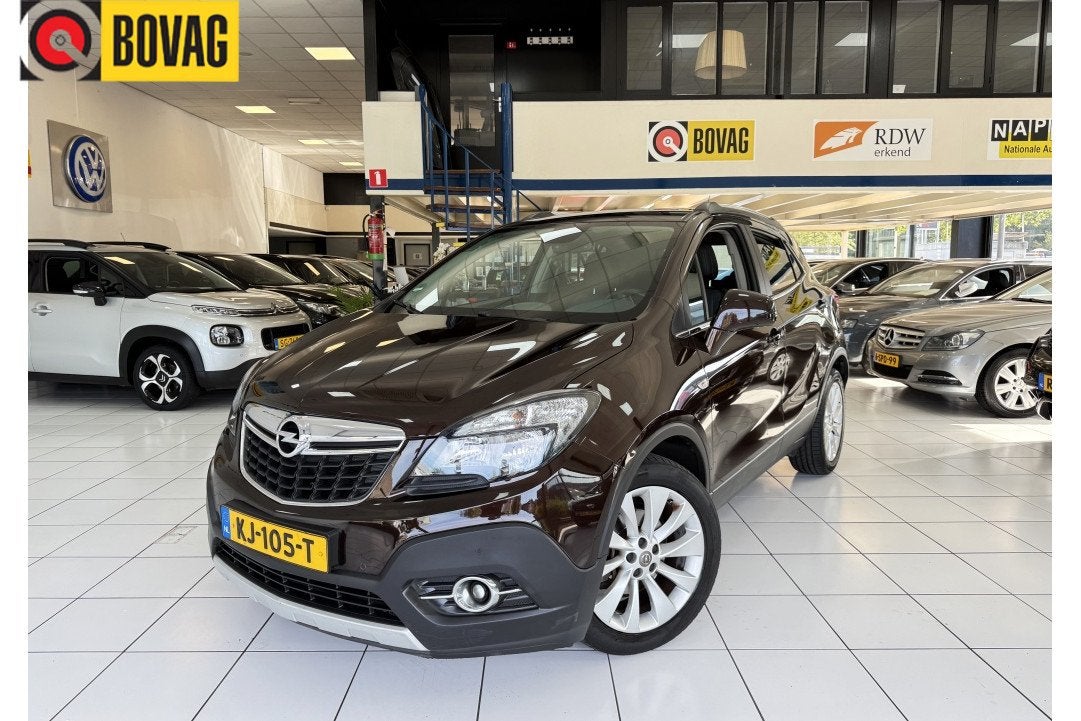 Opel Mokka 1.4 T Cosmo Bovag Garantie NAP (bj 2015), Auto's, Opel, Gebruikt, Euro 6, 4 cilinders, Bruin