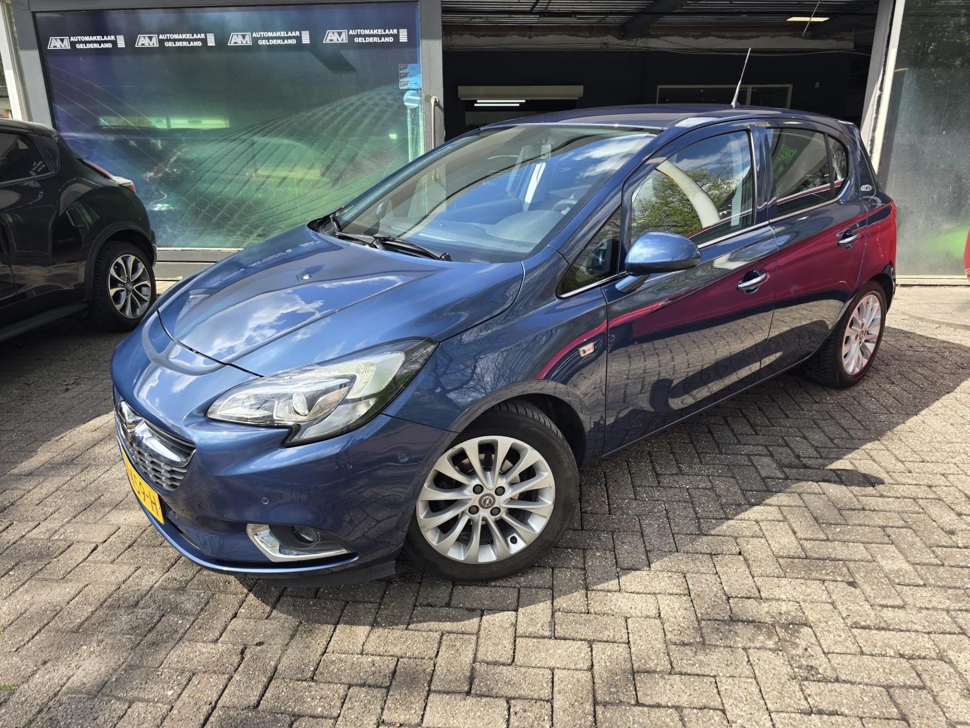 Opel Corsa 1.4 Cosmo | AUTOMAAT | 12MND GARANTIE | CAMERA |, Gebruikt, 4 cilinders, Blauw, 49 €/maand