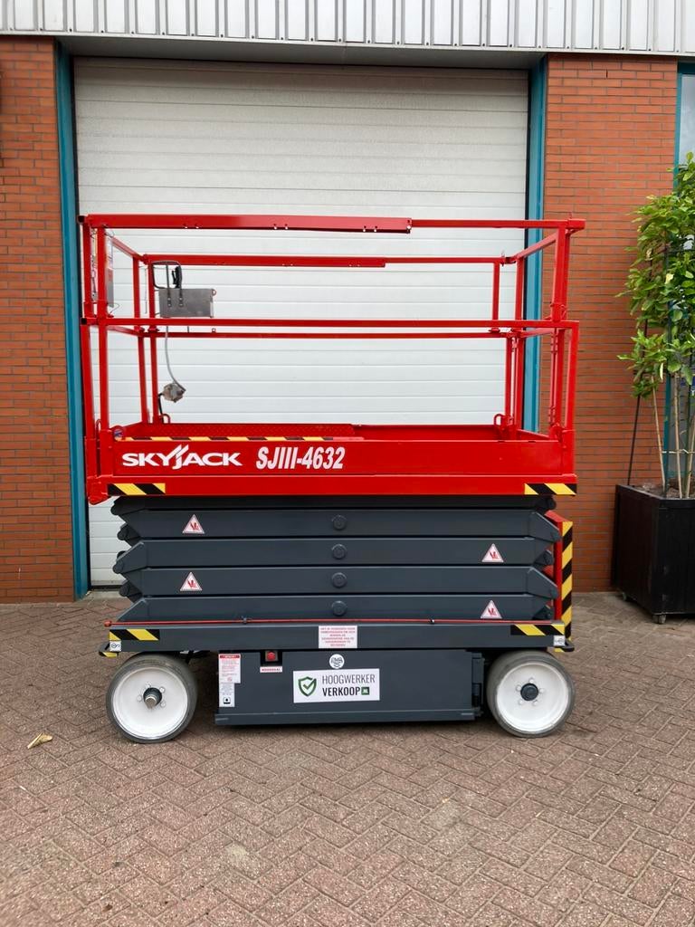 Sky jack4632  12 m schaarhoogwerker, Ophalen, Zo goed als nieuw