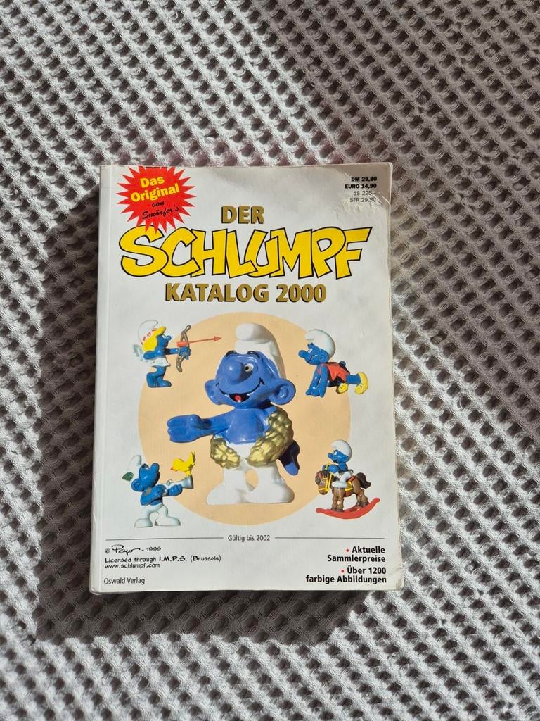 Smurfen catalogus 2002 Schlumpf katalog, Ophalen of Verzenden, Zo goed als nieuw, Verschillende Smurfen