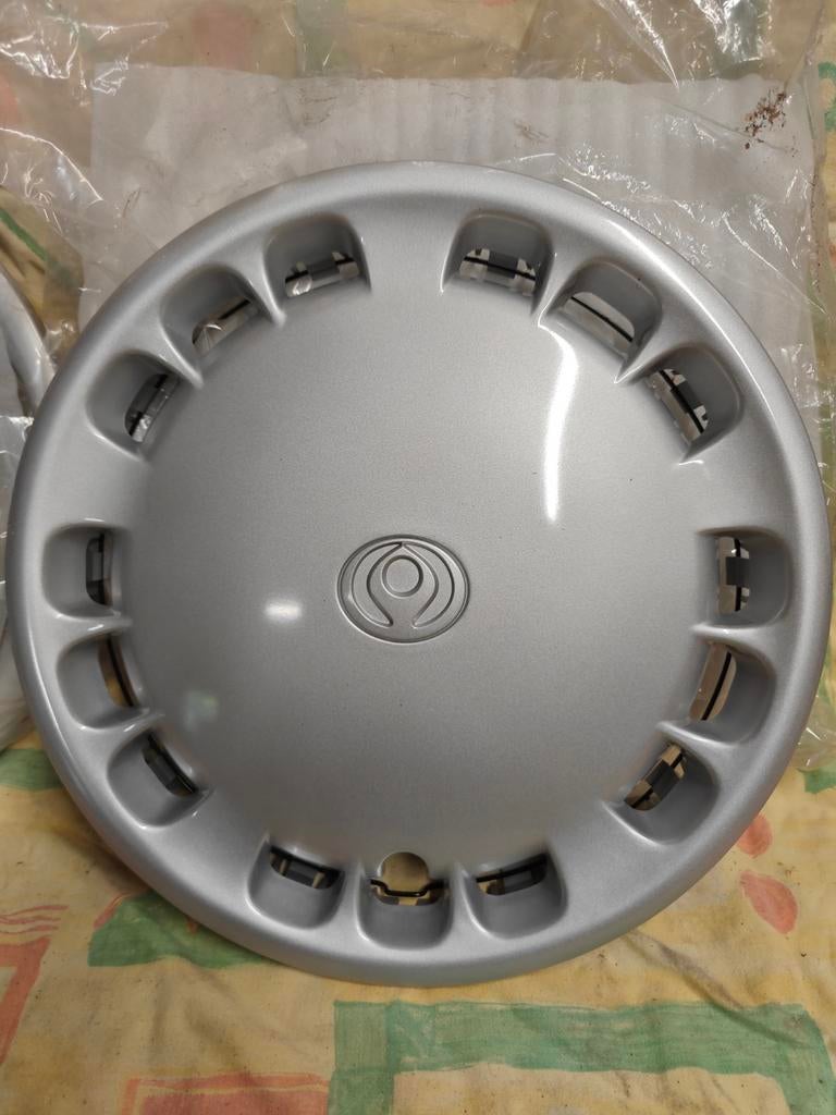Nieuwe wieldoppen 4 stuks Mazda GA7C in plastic verpakking, Ophalen