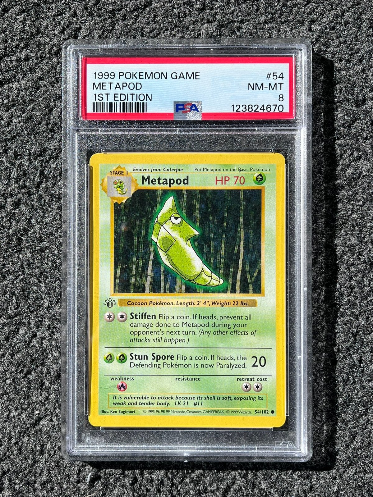 Pokémon PSA 8 1st edition Metapod #54 Base set 1999, Ophalen of Verzenden, Zo goed als nieuw, Losse kaart, Foil
