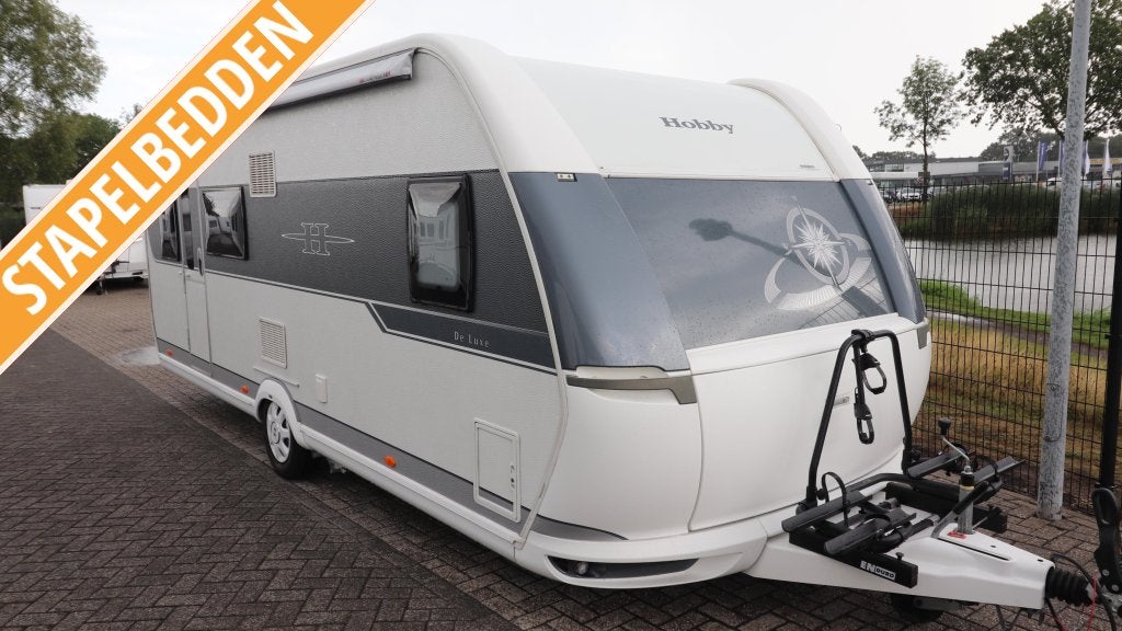 Hobby De Luxe 560 KMFE BJ. 2015 / Voortent + luifel + mover, Caravans en Kamperen, Rondzit, Hobby, Bedrijf, Dwars-stapelbed