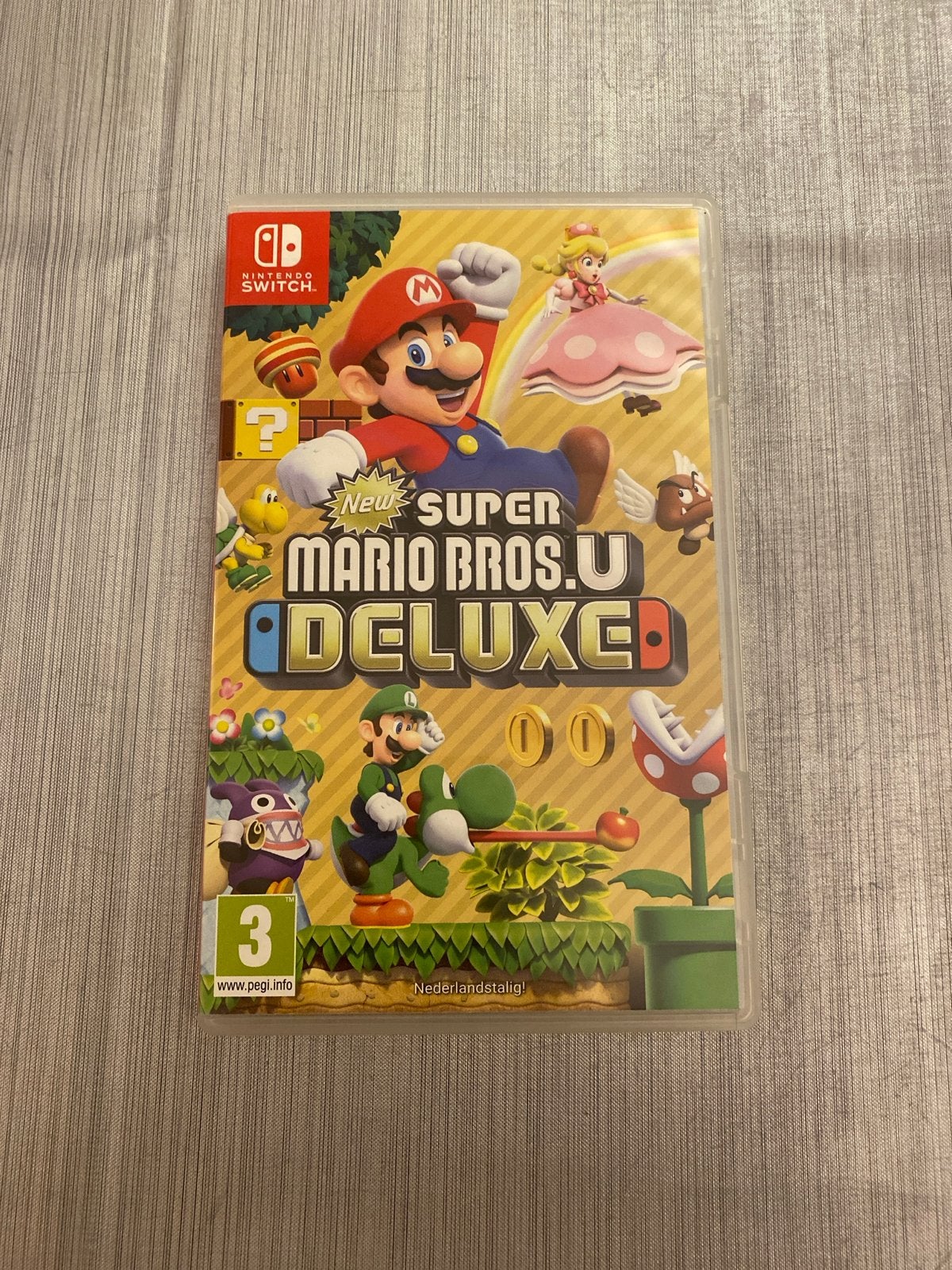 New Super Mario Bros. U Deluxe (Nintendo Switch), Spelcomputers en Games, Eén computer, Ophalen of Verzenden, Zo goed als nieuw