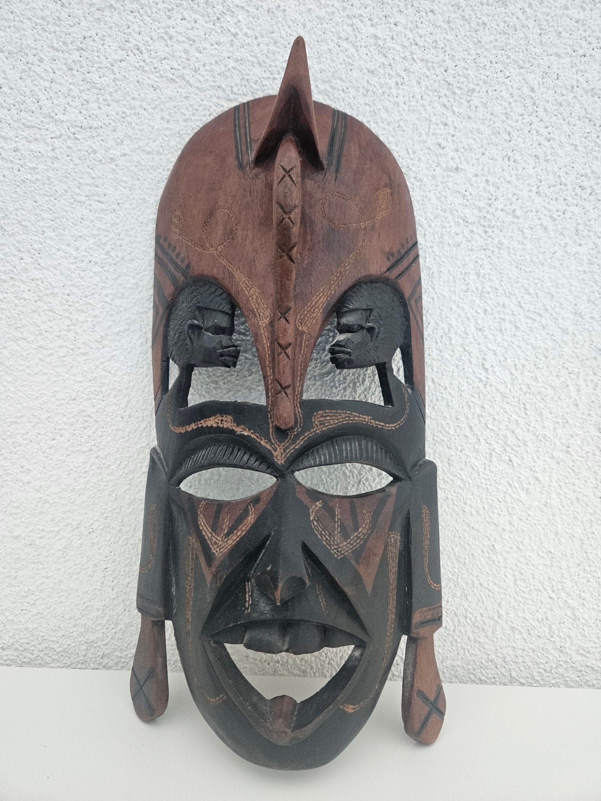 Groot masker uit Kenya, Ophalen