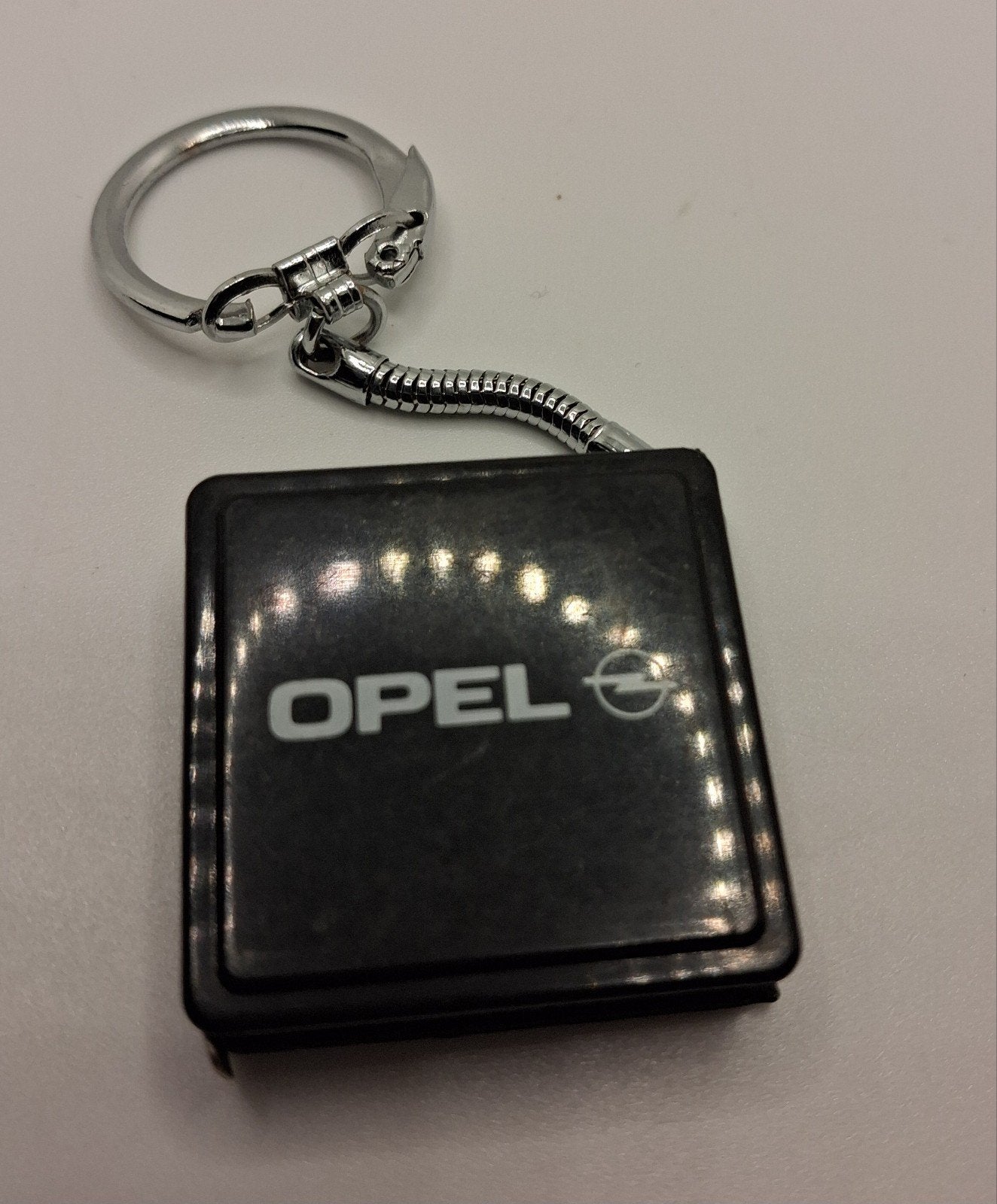 Vintage Opel sleutelhanger met rolmaat, Ophalen of Verzenden