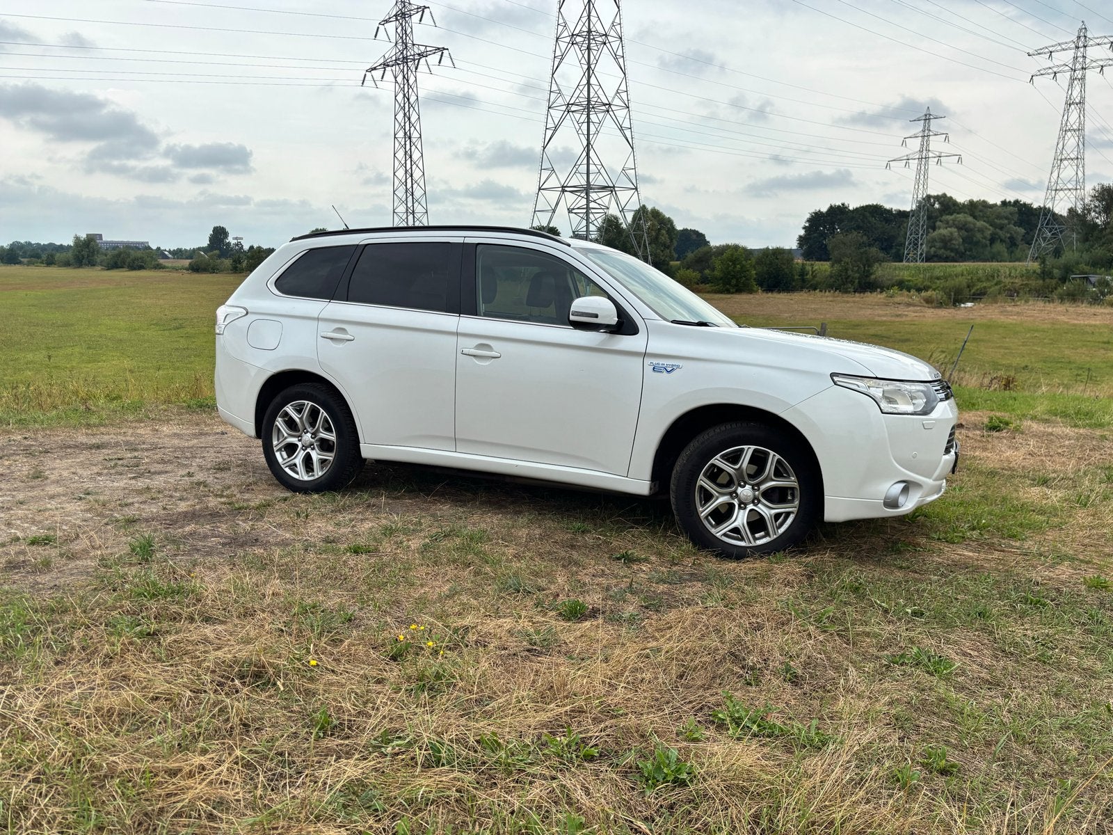 Zorgeloze & full option Mitsubishi Outlander PHEV (Instyle+), 1998 cc, Outlander, Zwart, 4 cilinders