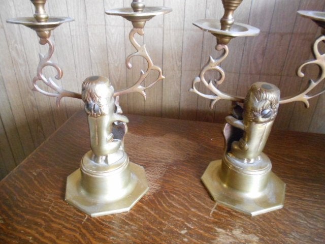 2 amsterdammertjes  met leeuwen kopjes kandelaars  art deco, Ophalen of Verzenden, Koper of Brons
