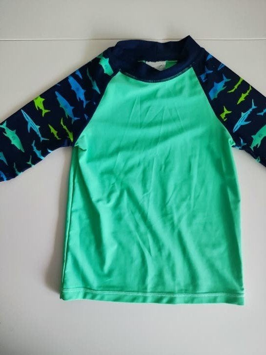 H&M UV-zwemshirt maat 110/116, Kinderen en Baby's, Babykleding | Baby-zwemkleding, UV-zwemkleding, H&M, Ophalen of Verzenden, Zo goed als nieuw