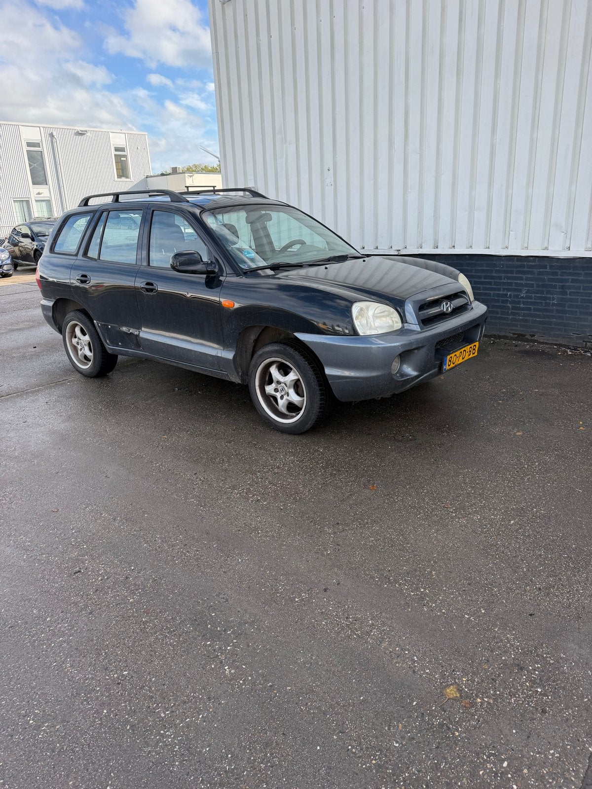 Hyundai Santa Fe 2.0 I 16V 2WD 2004 Zwart, Auto's, Voorwielaandrijving, Santa Fe, 4 cilinders, 2000 kg